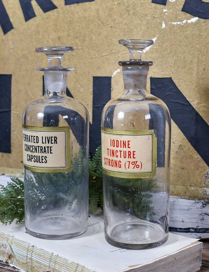 Antique apothecary jars with original labels and stoppers. 